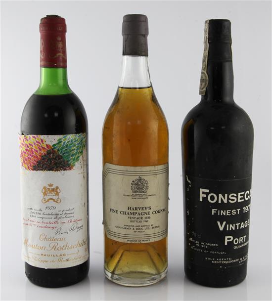 One bottle of Chateau Mouton Rothschild, 1979, a bottle of port and a bottle of cognac.